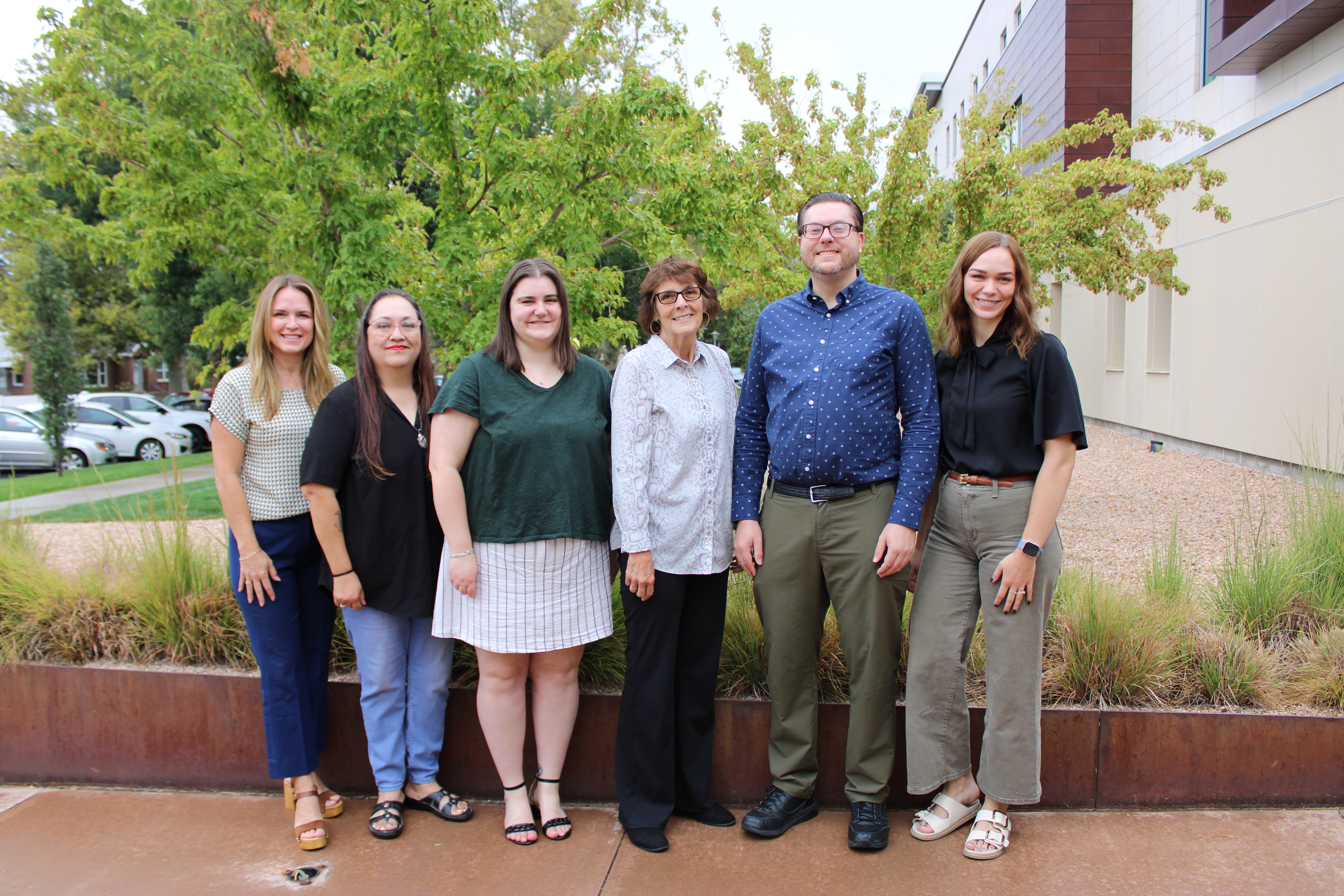 6 members of the Davis Links Resource Forum Planning Committee standing outside Davis County Admin Building